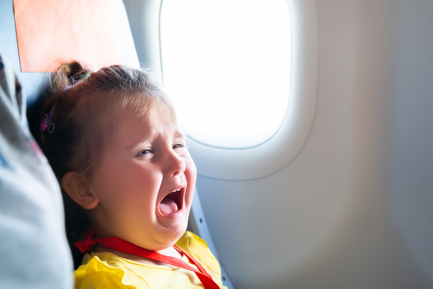 little girl screaming on an airplane