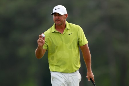 Brooks Koepka reacts to his birdie on the 18th green during the first round of the 2023 Masters Tournament