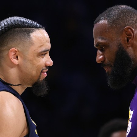 LeBron James #6 of the Los Angeles Lakers talks with Dillon Brooks #24 of the Memphis Grizzlies before Game Three of the Western Conference First Round Playoffs at Crypto.com Arena on April 22, 2023 in Los Angeles, California.