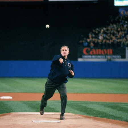President George W. Bush throws out the ceremonial first pitch before Game Three of the 2001 World Series between the Arizona Diamondbacks and the New York Yankees at Yankee Stadium on October 30, 2001 in Bronx, New York.