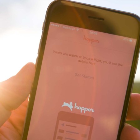 A smartphone with the popular travel app Hopper pulled up. We looked into the new tip charge on Hopper bills.