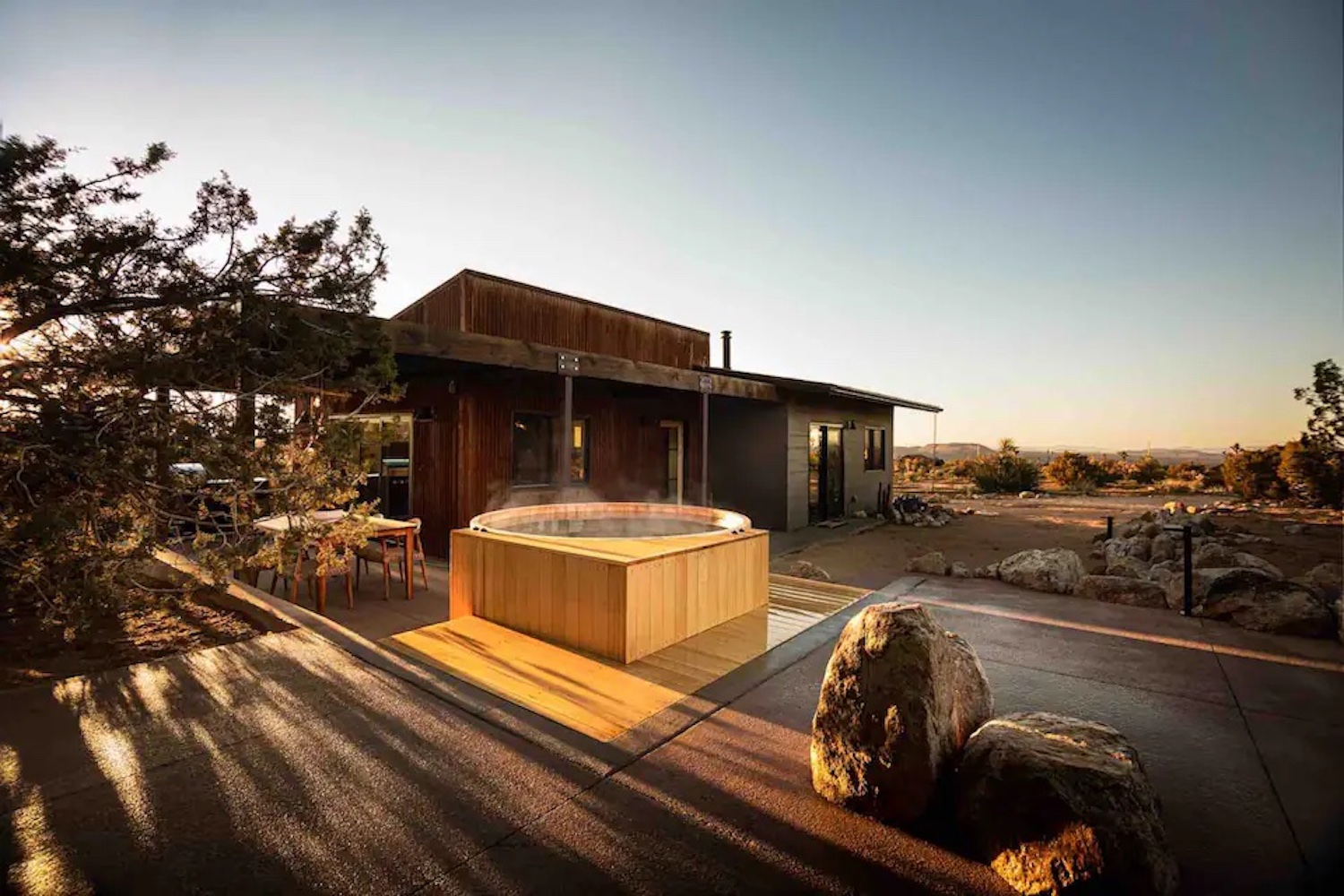 The outside of the Juniper Cabin and a cedar hot tub