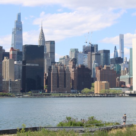 A runner running along the Long Island City waterfront.
