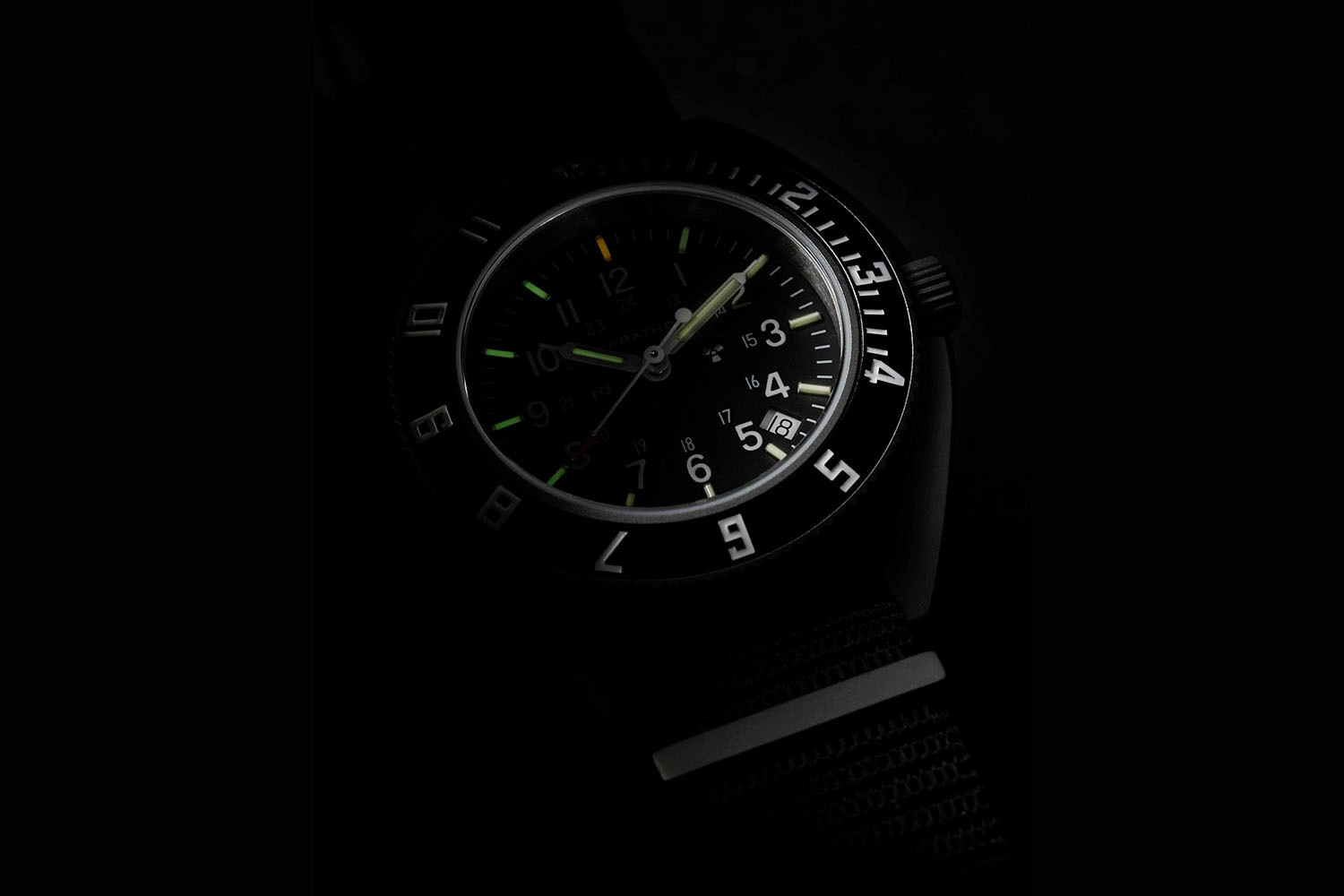 A darkened image with parts of a watch
