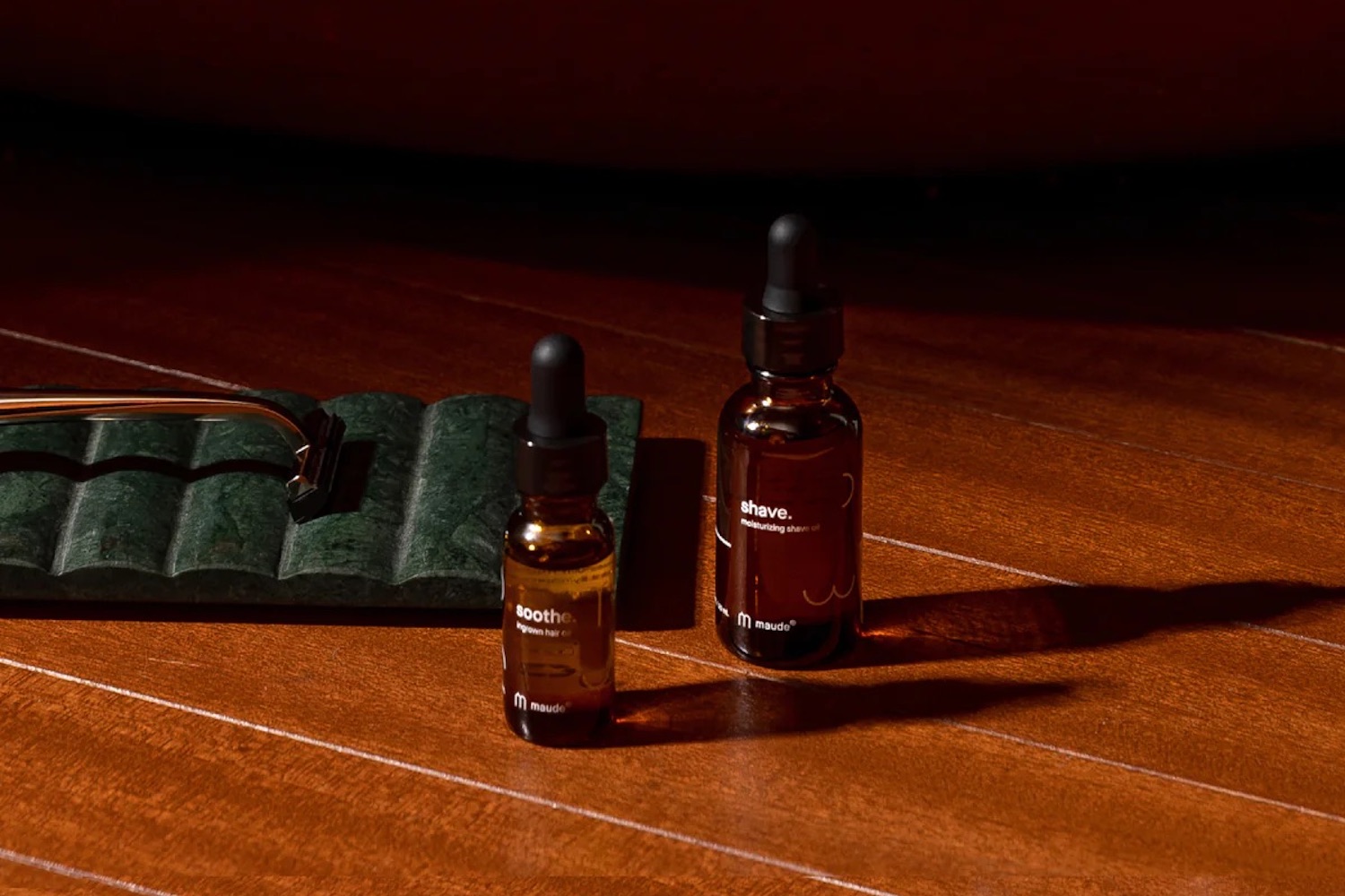 a Maude grooming set on a wooden background