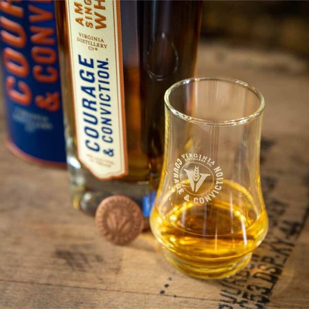 Two bottles and a dram of Courage and Conviction, the flagship release of Virginia Distillery Co.