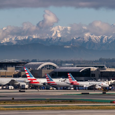 Hollywood sign as seen from LAX with snow covered mountains in background © Pete Halvorsen