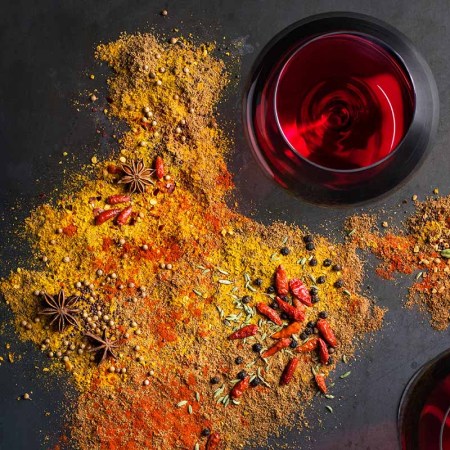 Spices and wineglasses on grey background. Sommelier Beverly Crandon pairs wines with spicy foods.