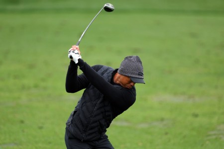 Tiger Woods swings on the golf course. The golfer and Justin Timberlake are behind a new luxury real estate development in Florida west of Palm Beach.