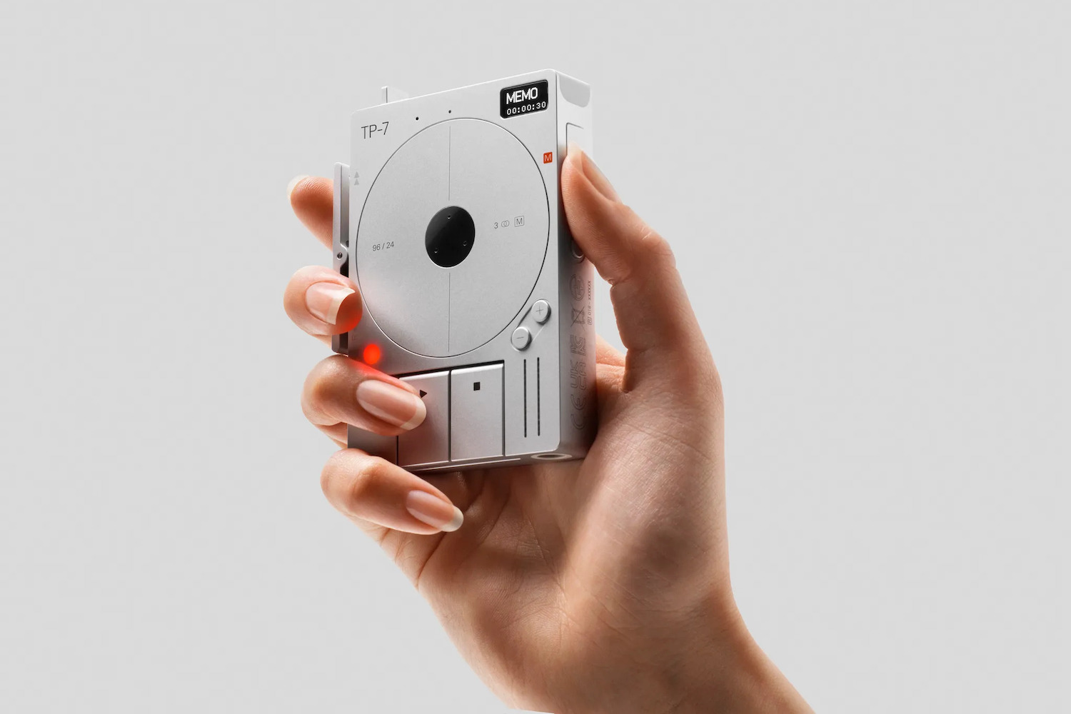a hand holding the Teenage Engineering TP-7 recorder
