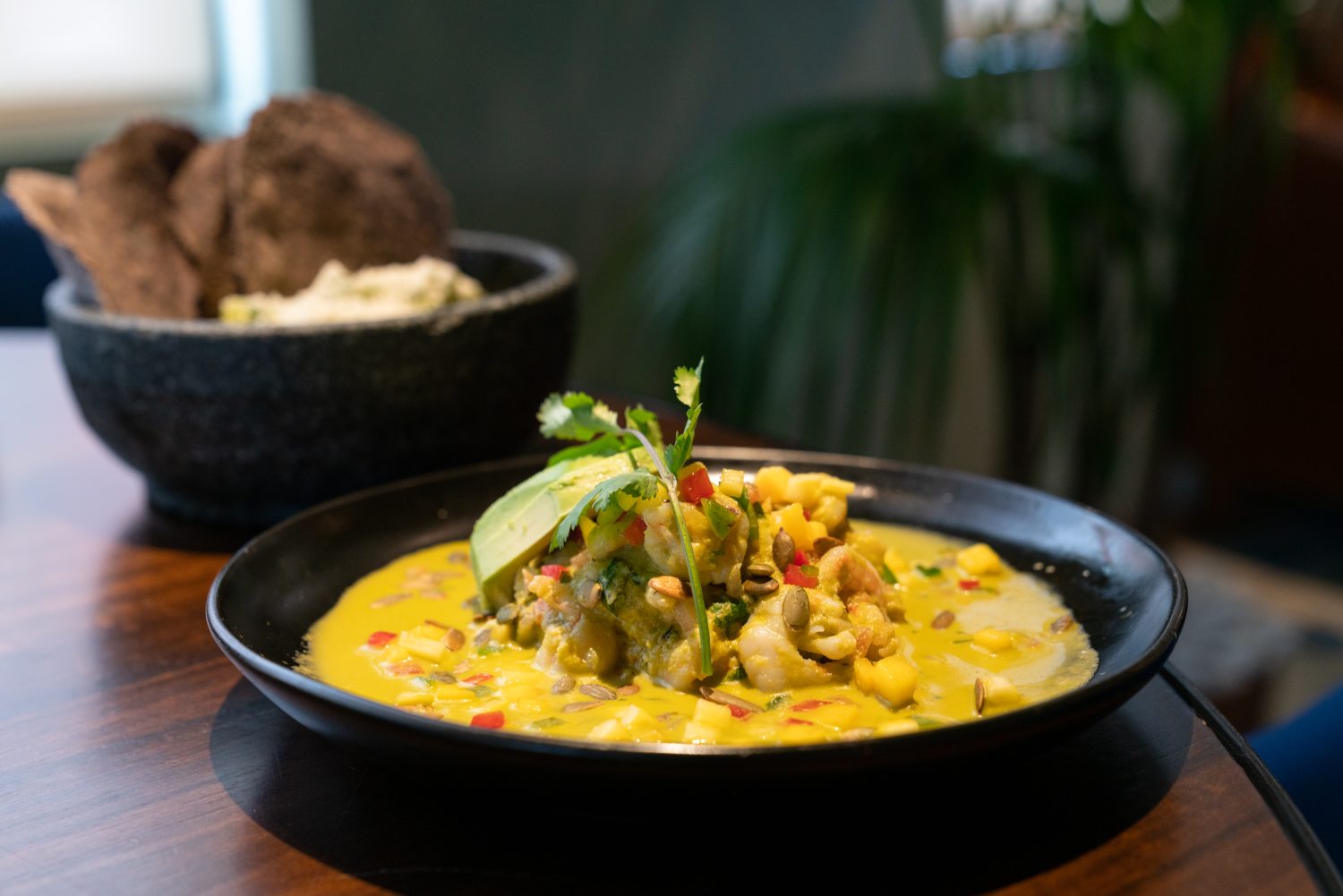 a mango-based fish dish in a skillet.