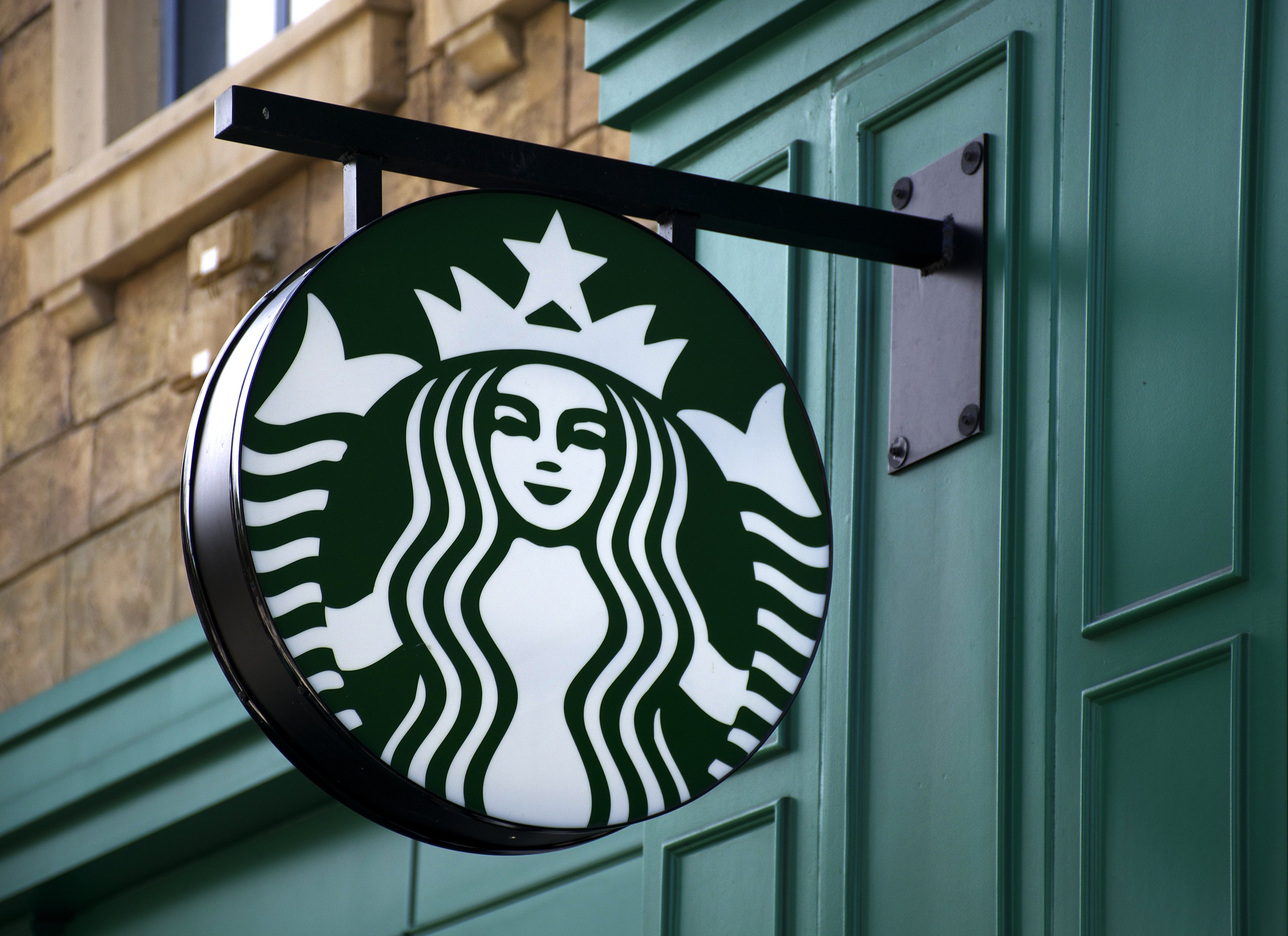 Starbucks sign outside of a store.