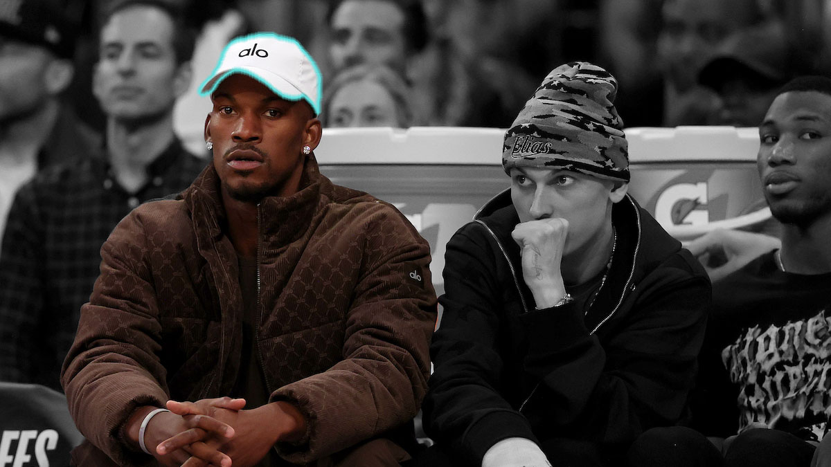a greyed out photo of Jimmy butler in a highlighted Alo Yoga Hat