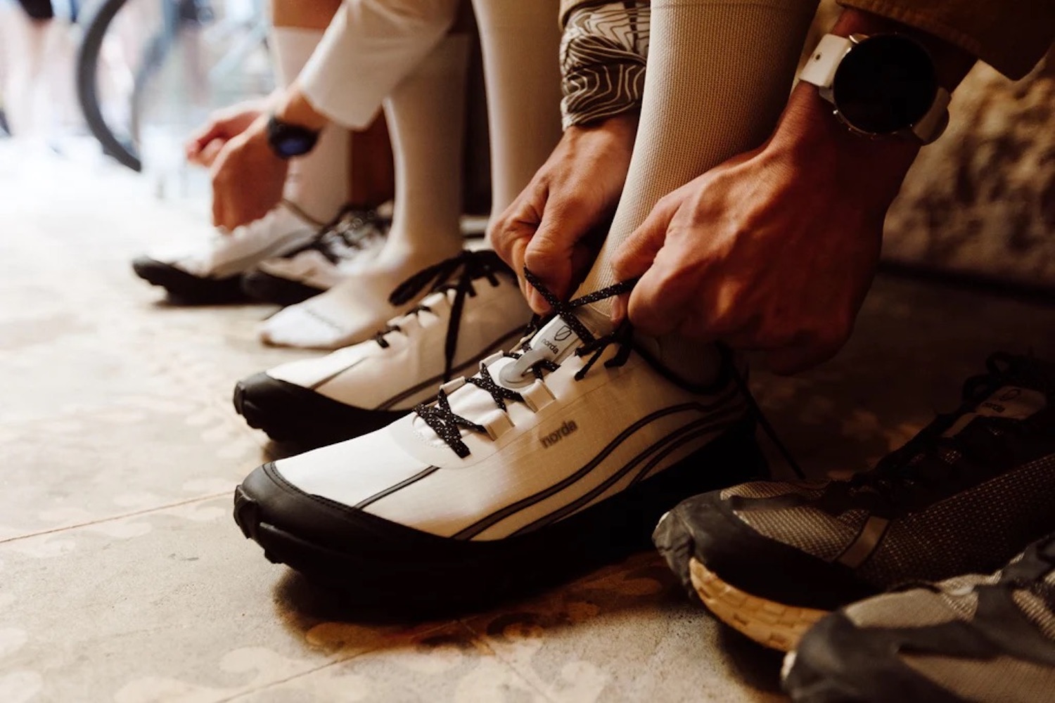 a lineup of Norda shoes on a grey bacgkround