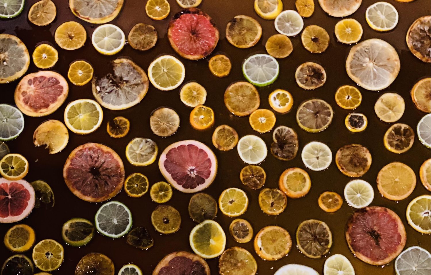 Slices of fruit sitting in liquid.
