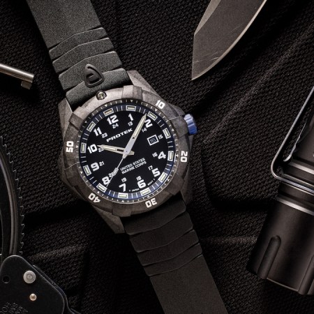 a photo of a Protek USMC watch on a black background