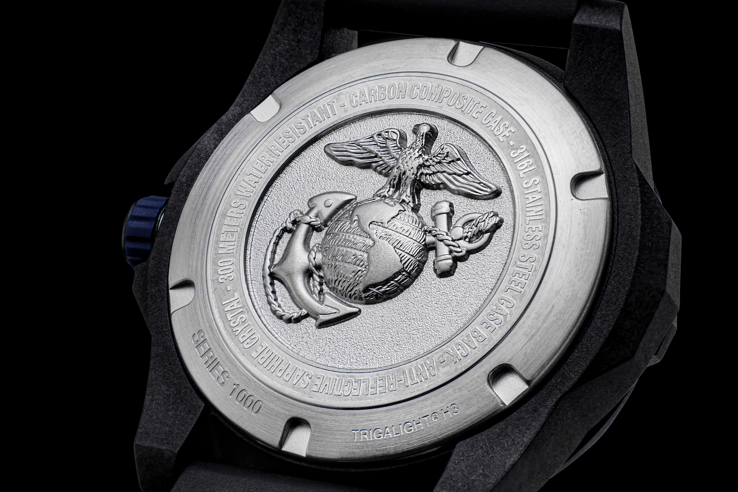 The back of a protek watch on a black background