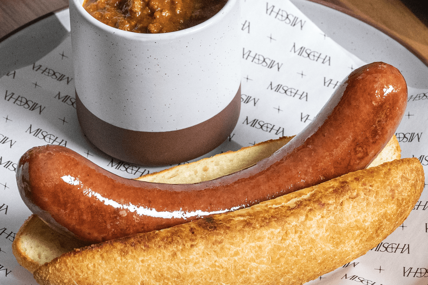 Mischa's hot dog weighs eight ounces.