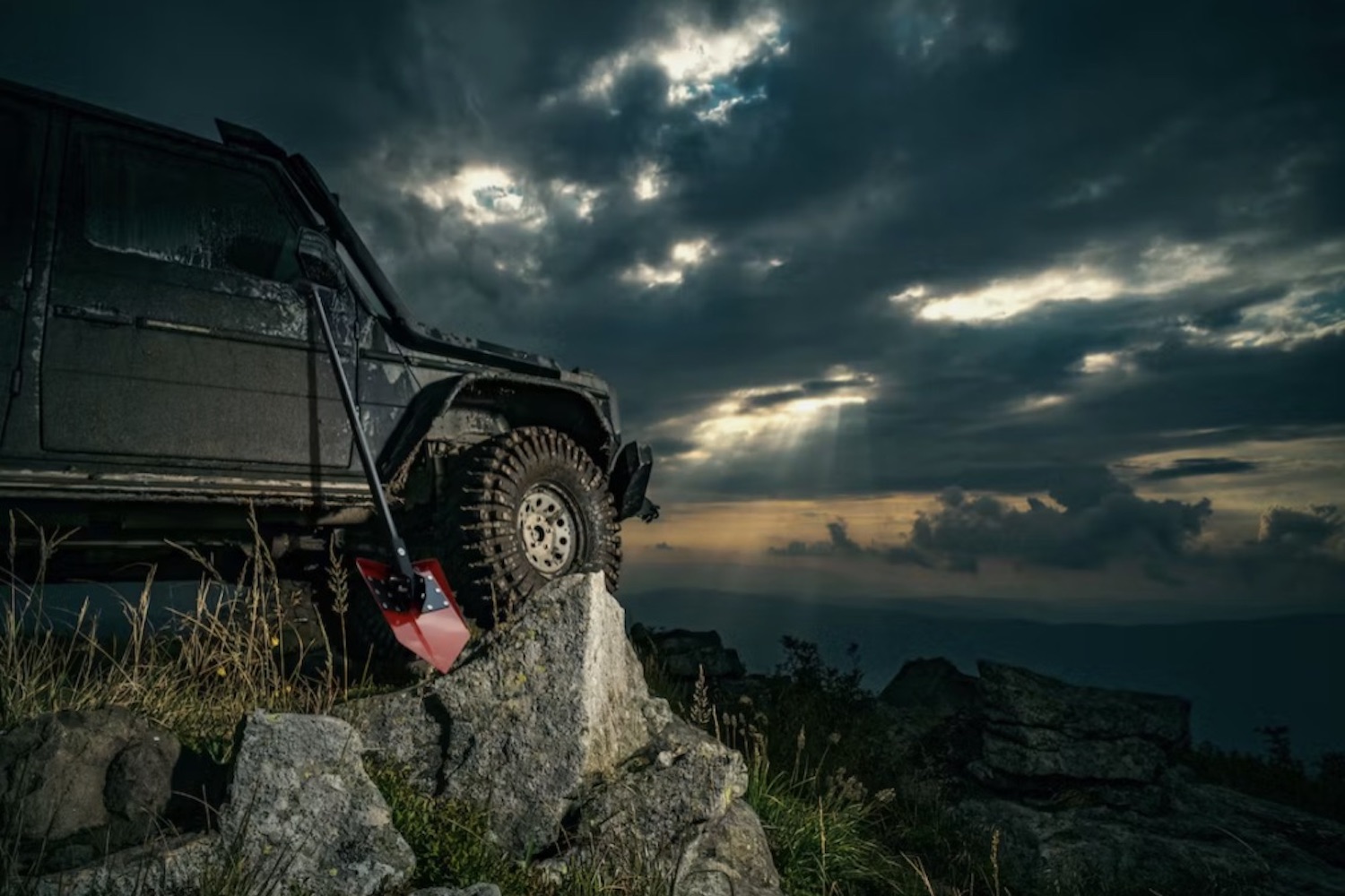 a DMOS Delta Shovel leaned up against a truck on a cliffside lookout