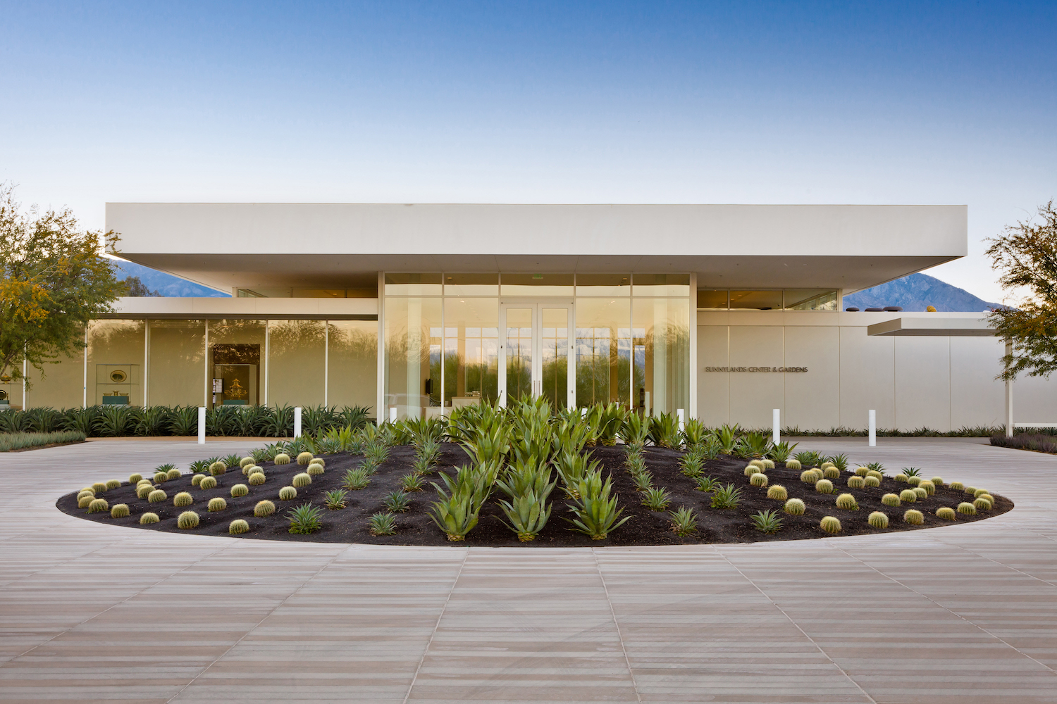 outdoor garden area in front of white building