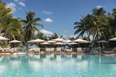 pool area with seating and umbrellas at the Ritz-Carlton, South Beach in Miami, Florida
