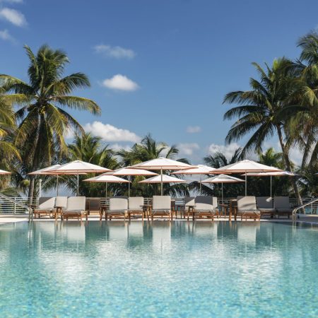pool area with seating and umbrellas at the Ritz-Carlton, South Beach in Miami, Florida