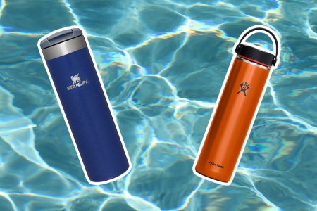 Two water bottles from Hydro Flask and Stanley on a water like background