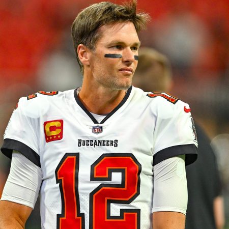 Tom Brady warms up prior to the start of an NFL game.