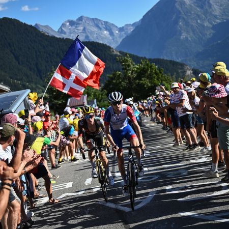 A show of cyclists rumbling through the Alps.