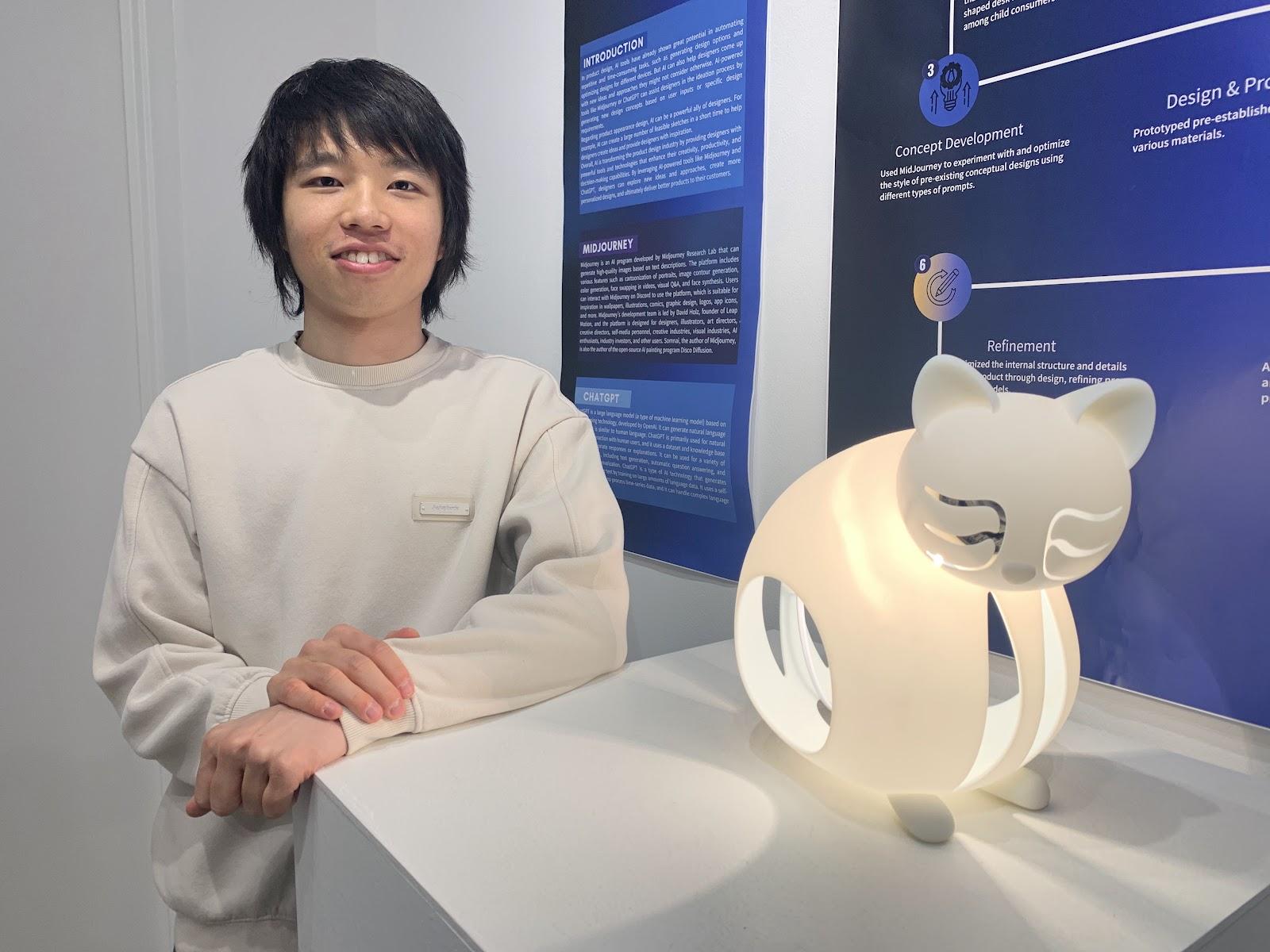 student posing with artwork