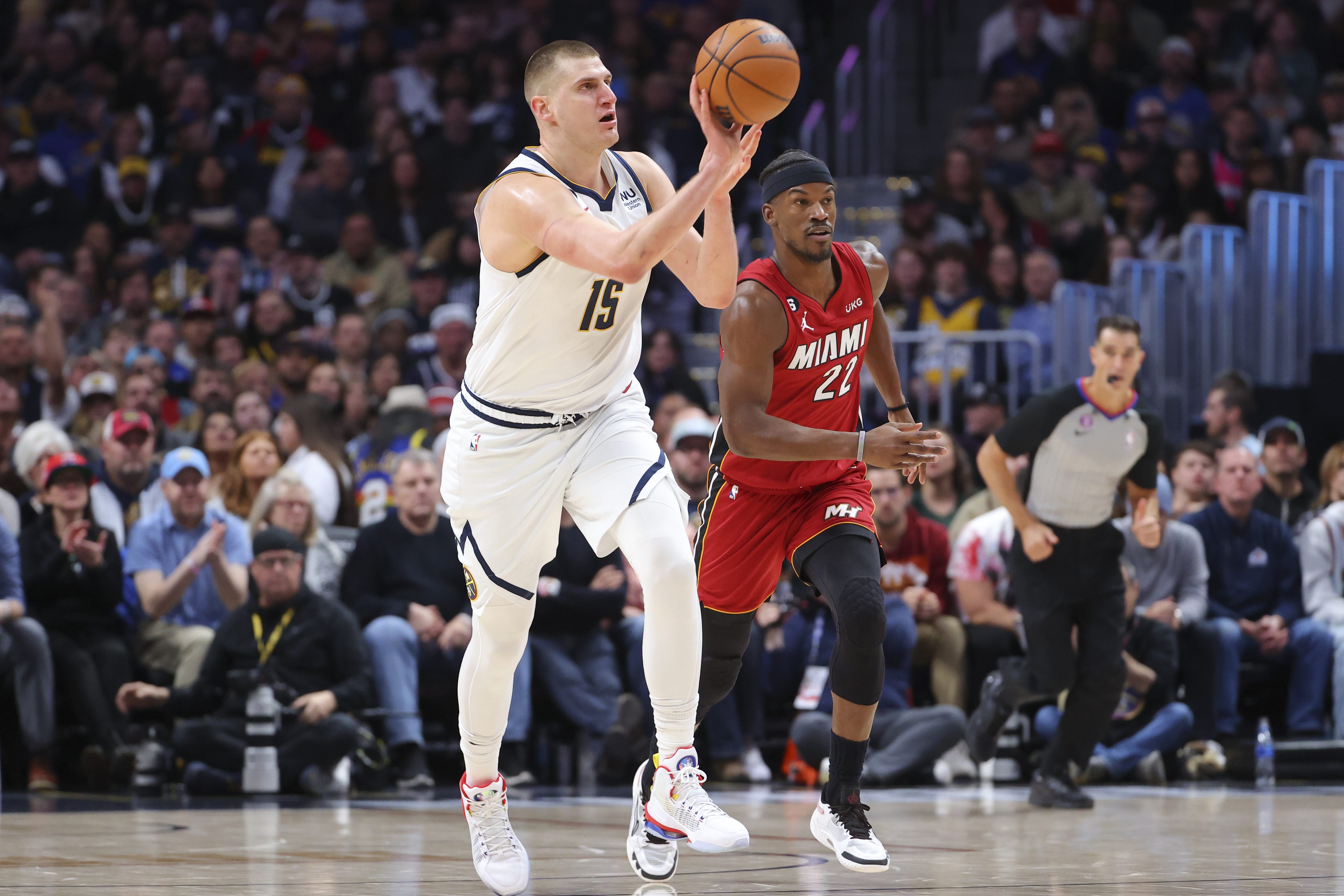 Nikola Jokić and Jimmy Butler on the court.