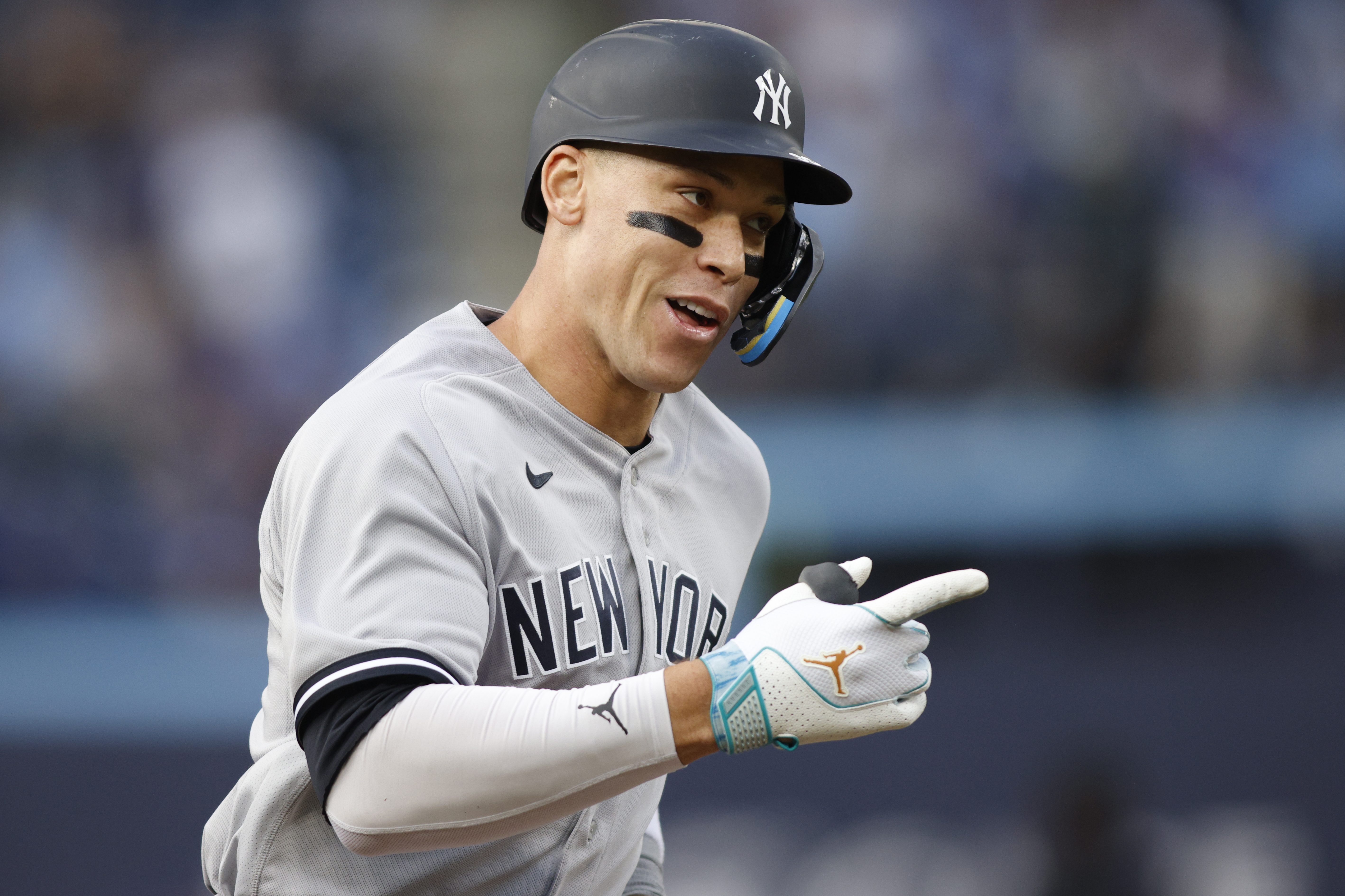Aaron Judge of the Yankees runs out a home run against the Blue Jays.