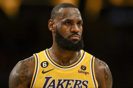 LeBron James stands on the court against the Denver Nuggets.