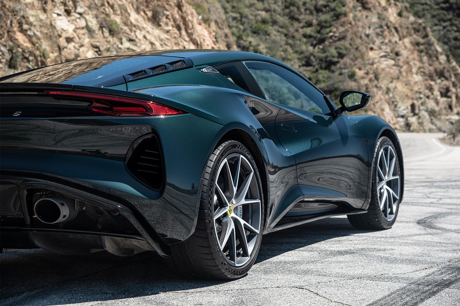 The rear three-quarters view of the Lotus Emira