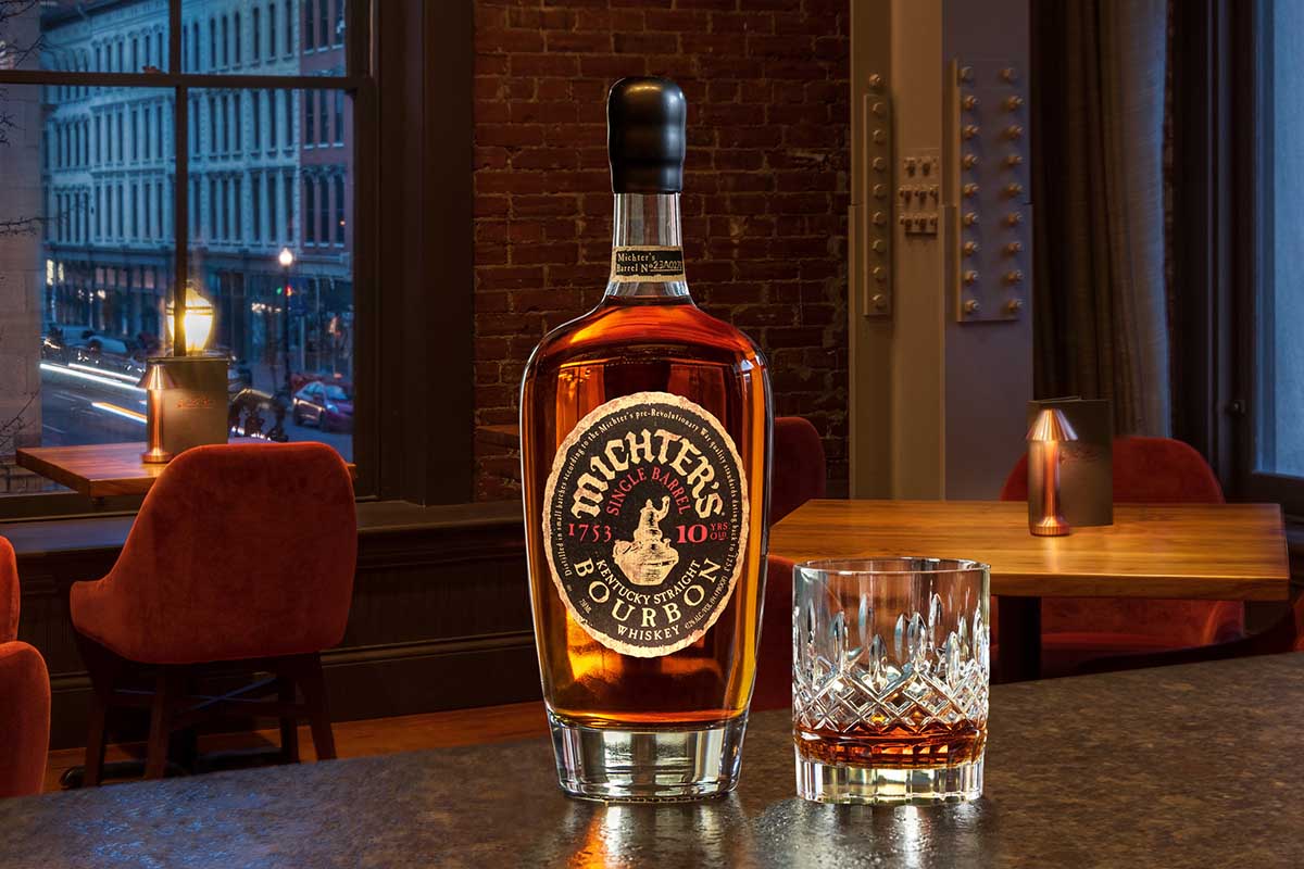A bottle and a glass of Michter's 10