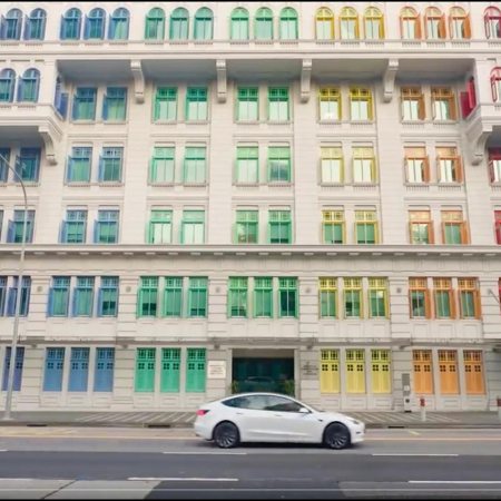 A screenshot of a Tesla Model 3 driving in a "Drive to Believe" video shot in Singapore. Is this a peek into Tesla's new advertising campaigns?