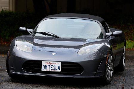 Dale Miller drives his Tesla Roadster in San Rafael, Calif. on Thursday, March 15, 2018. Miller's Roadster, number 1191 off the assembly line with the license plate DM TESLA, is the first of three Teslas he and his wife own.
