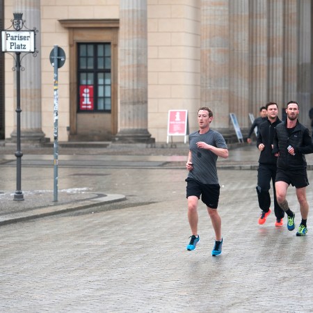 Mark Zuckerberg running with bodyguards in Berlin.