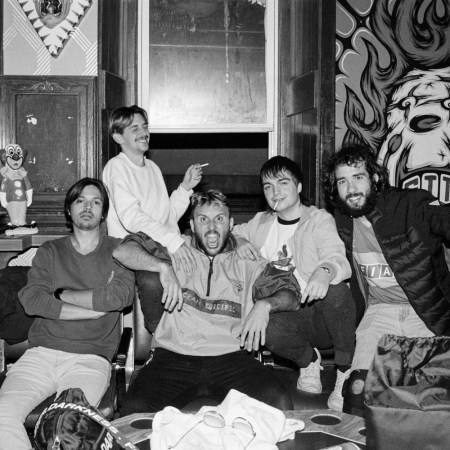 band members sitting on the couch