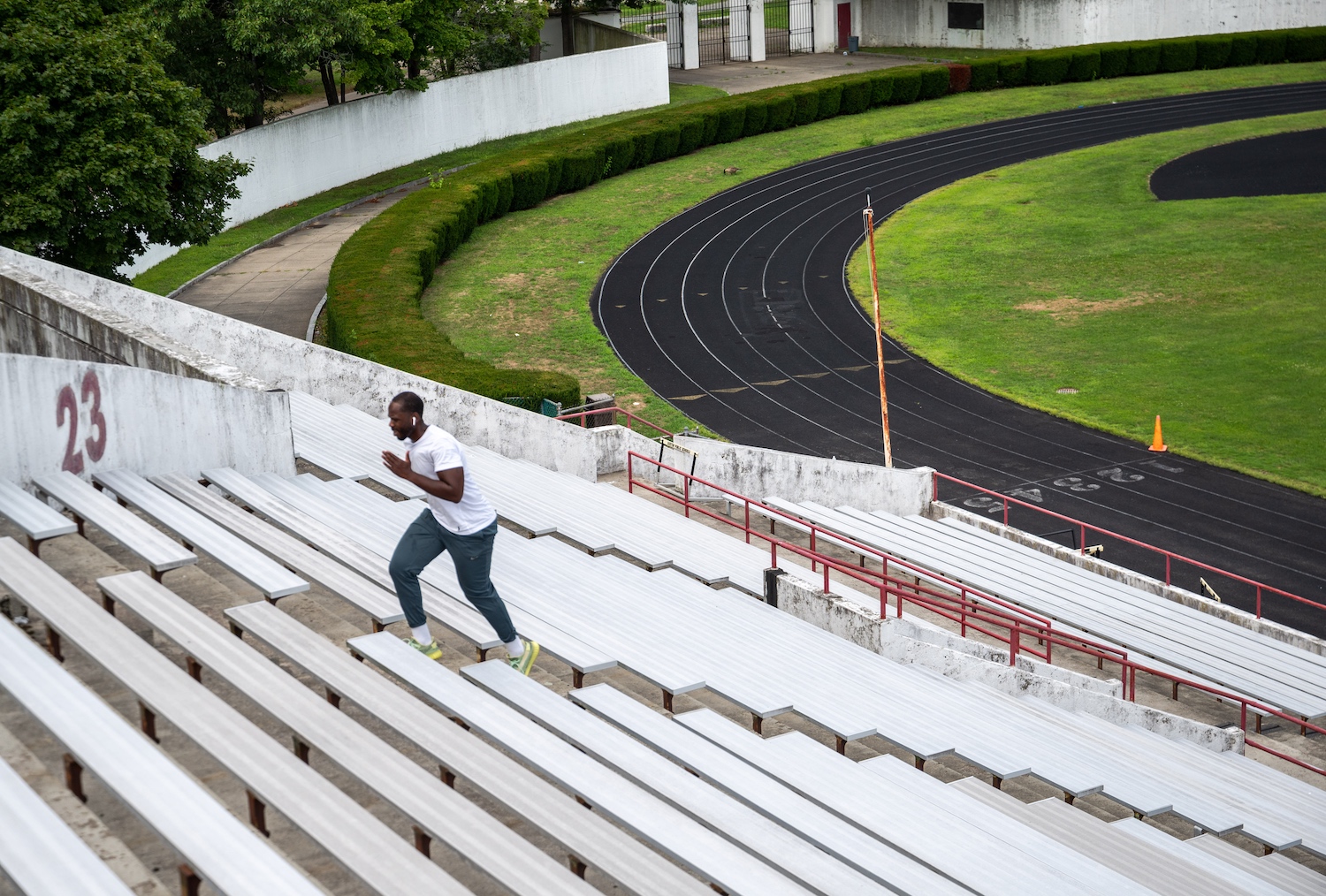 A man sprints up stadium steps.