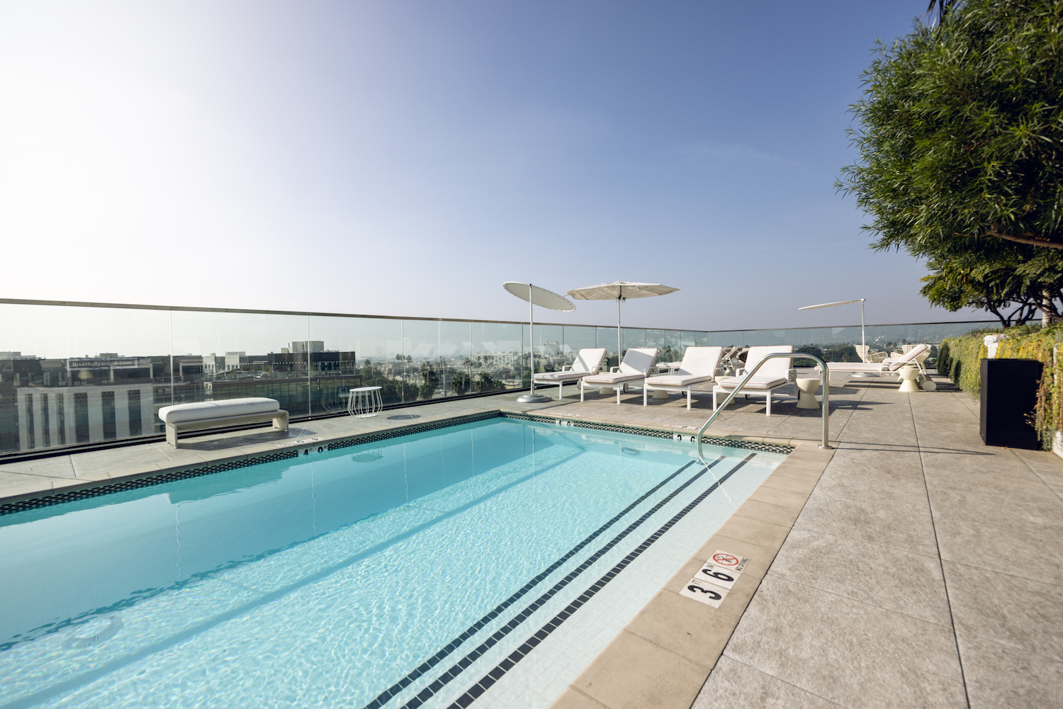 chairs poolside on a scenic overlook.