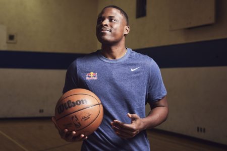 Chris Matthews holds a basketball.