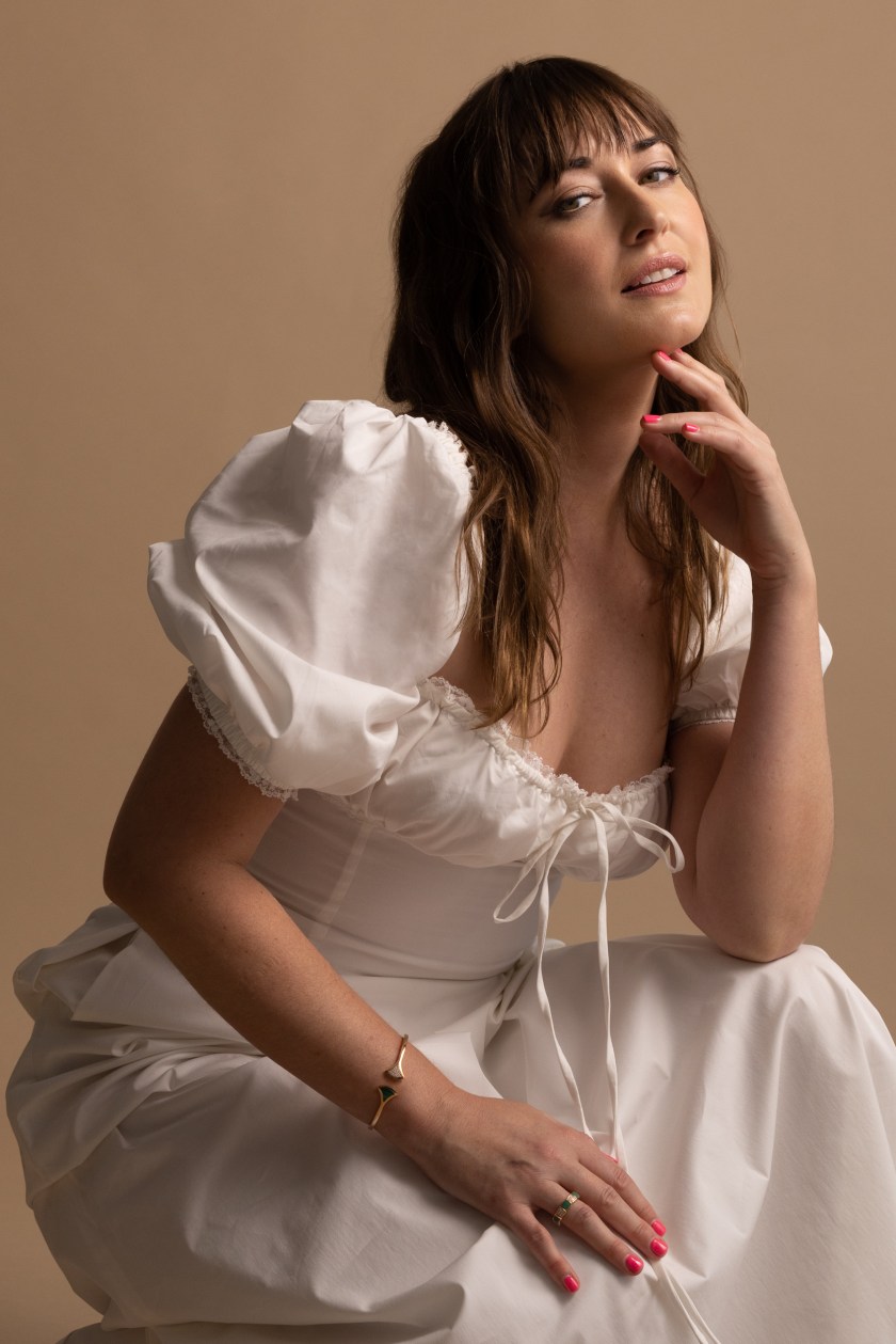 Jess Williamson in a white House of CB Dress, promoting her new album Time Ain't Accidental