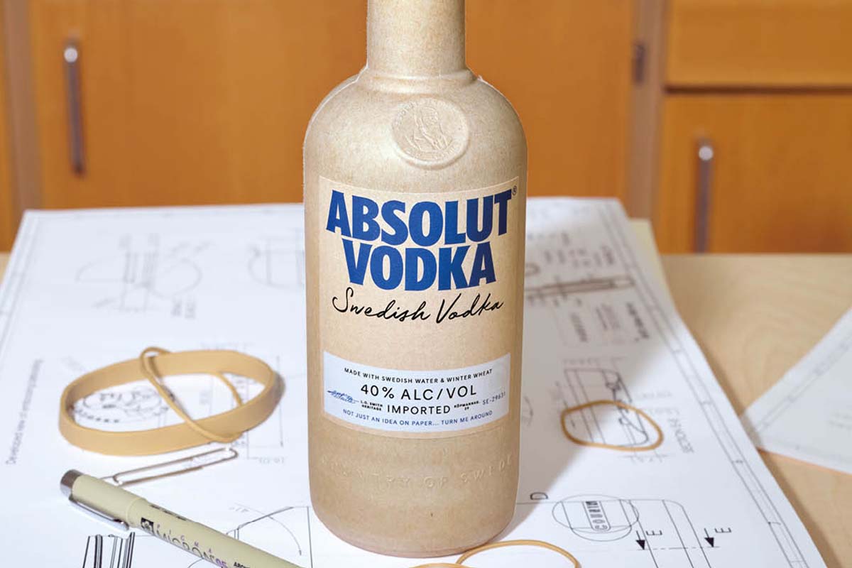 The new paper bottle for Absolut Vodka, sitting on a desk