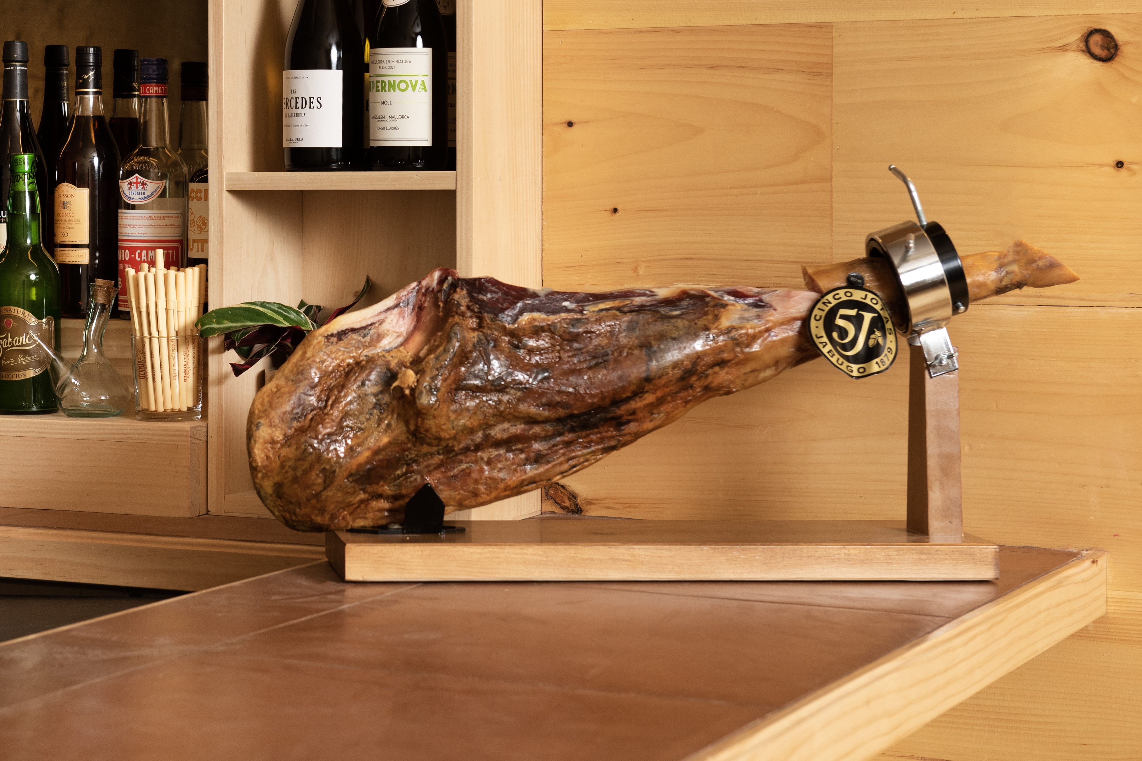 Jamón sits on the bar at Bar Vinazo.
