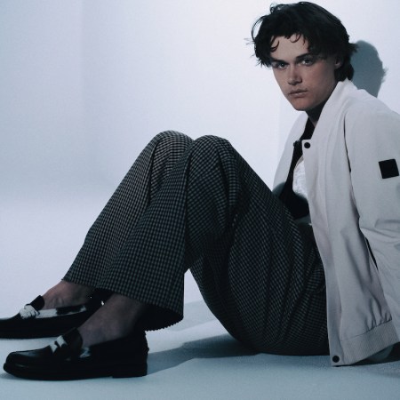 a photo of actor Chris Briney in a white jacket against a white background