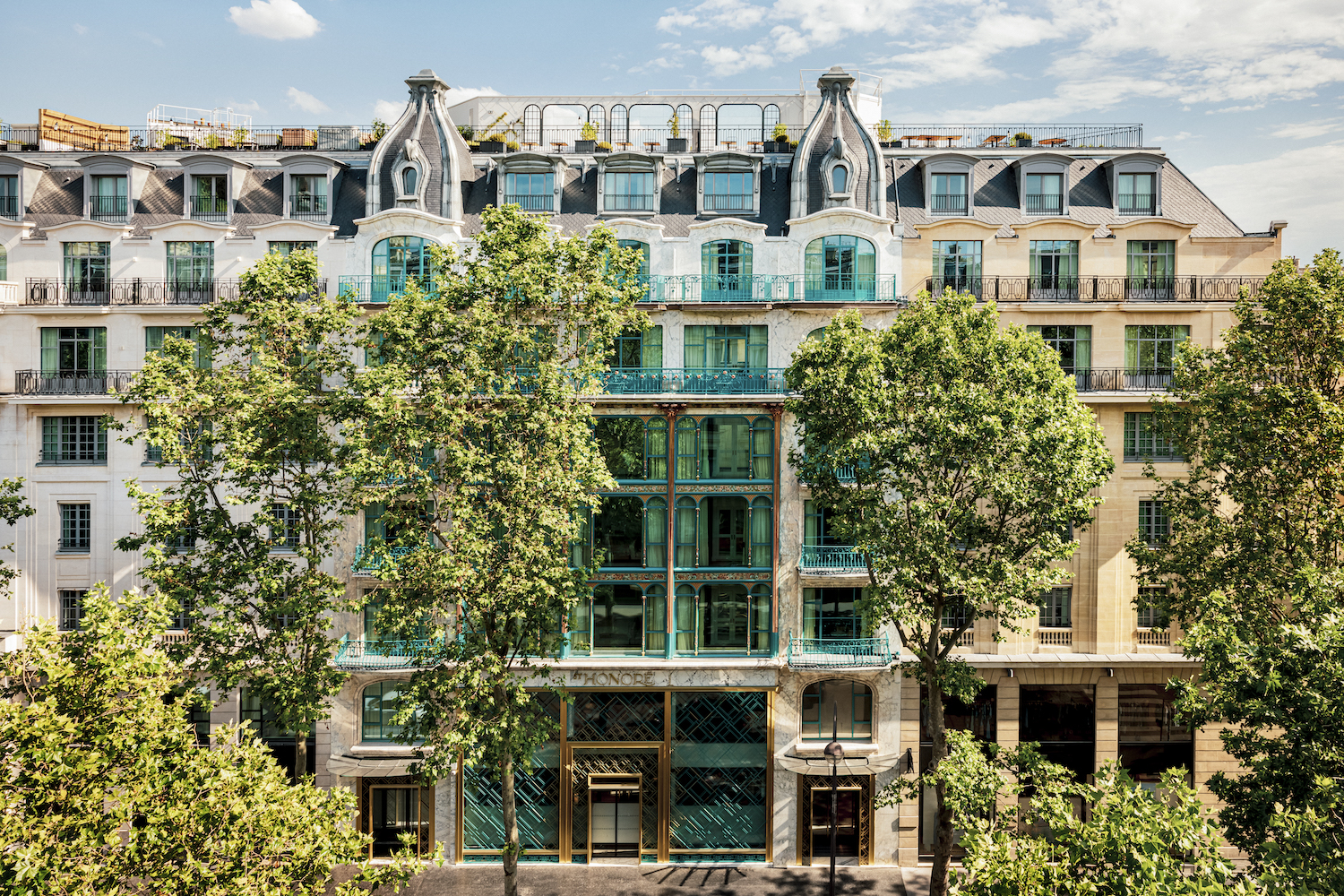 a large white and blue hotel building.