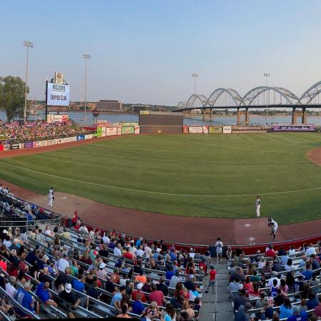 baseball field overlooking ferris wheel and bridge