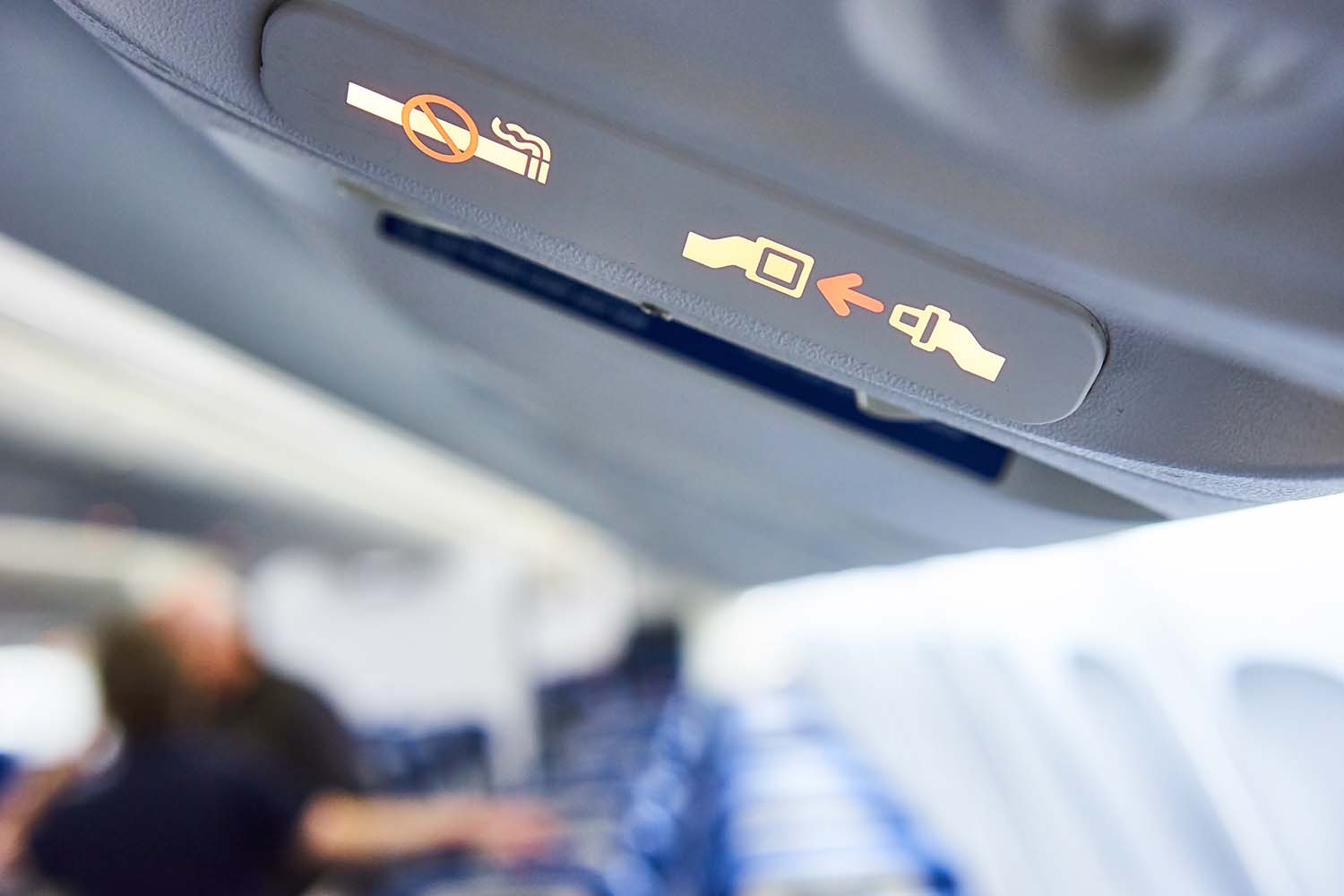 Fasten Seat belt sign and No Smoking sign on a plane