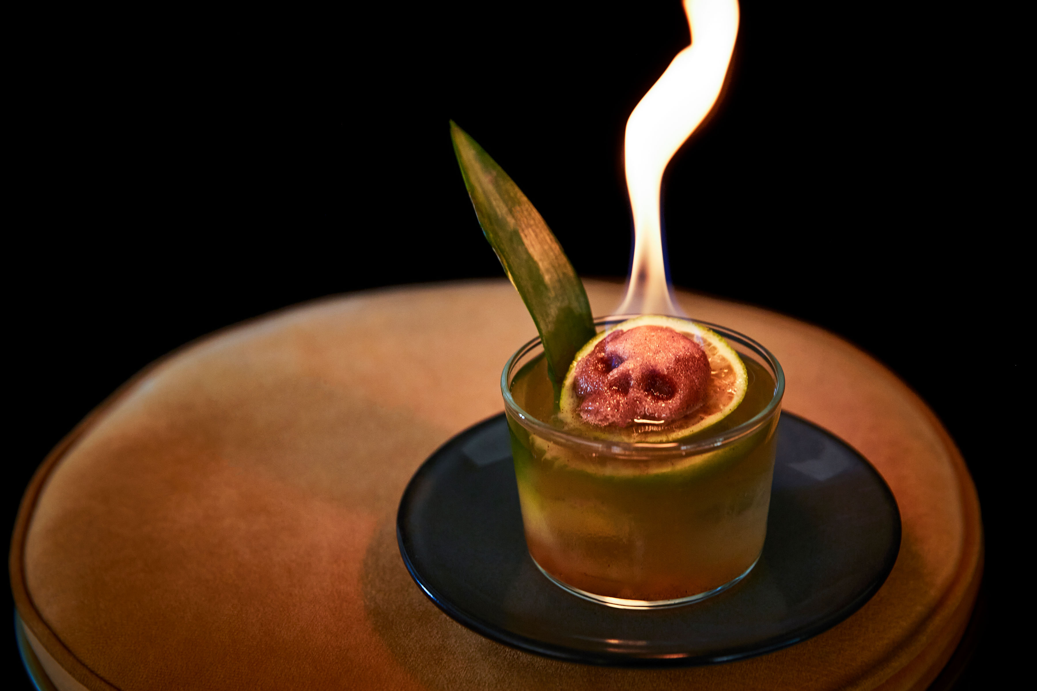 Cocktail with fire coming out of the top.